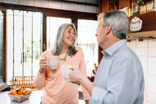 istock Senior couple bonding in the kitchen 1217706729
