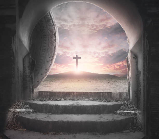 istock Easter Sunday concept: Tomb empty with cross on sunset background 1217707129
