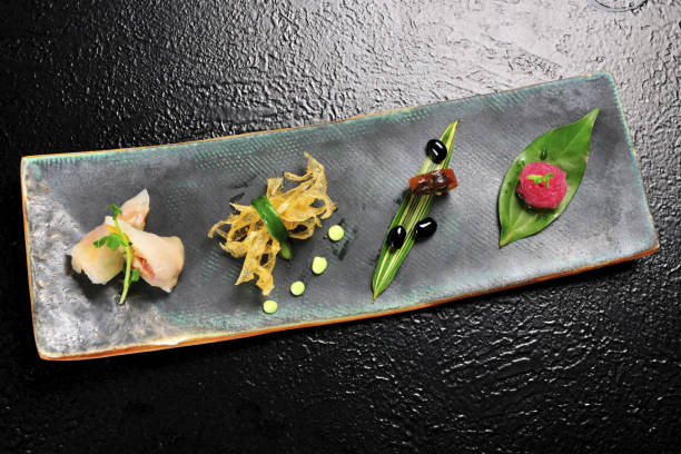 istock Various food served in the plate on the black table 1217708725