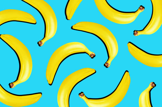 istock Top view. Yellow bananas on blue background. 1217712312
