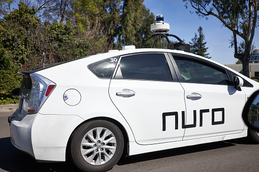Mountain View, CA, USA - Mar 4, 2020: American robotics technology company Nuro branded self-driving car is seen undergoing testing on the street in Mountain View, California.
