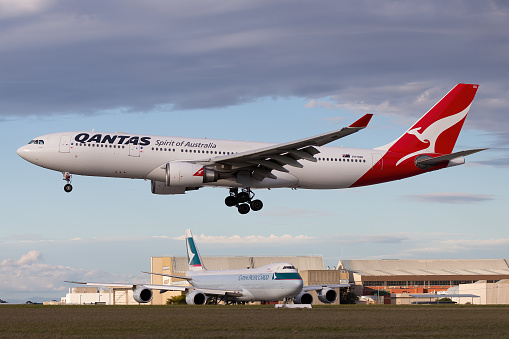 Melbourne, Australia - June 23, 2015: Airbus A330 large twin engine airliner operated by Qantas on approach to land at Melbourne International Airport.