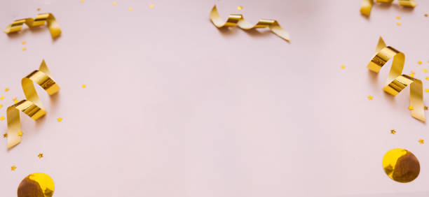 istock banner delicate beige background with yellow circles and gold spirals serpentines. layout for gifts, greetings, and sales. 1217718340