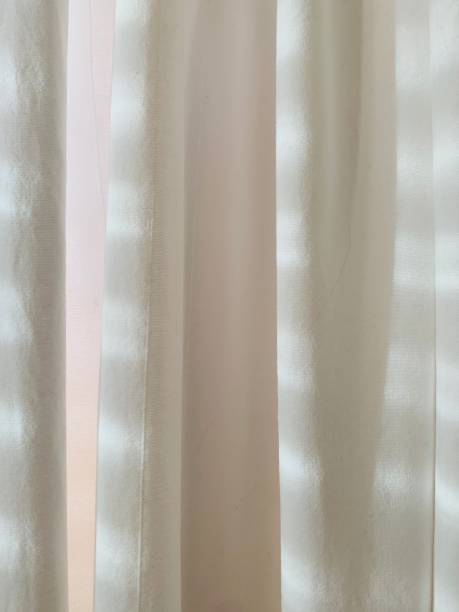 istock Sunlight on the curtain in the morning 1217719854