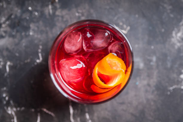 istock Red traditional old fashioned cocktail with orange zest on the rustic background 1217720703