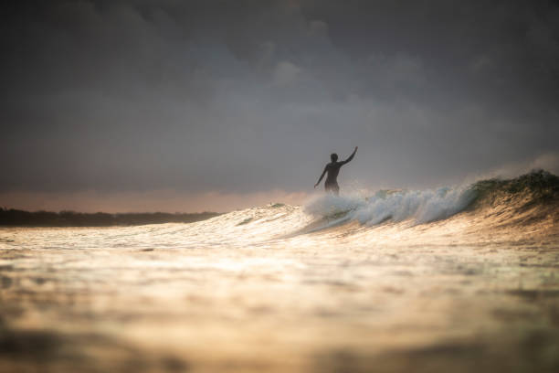 istock A man is surfing 1217723386