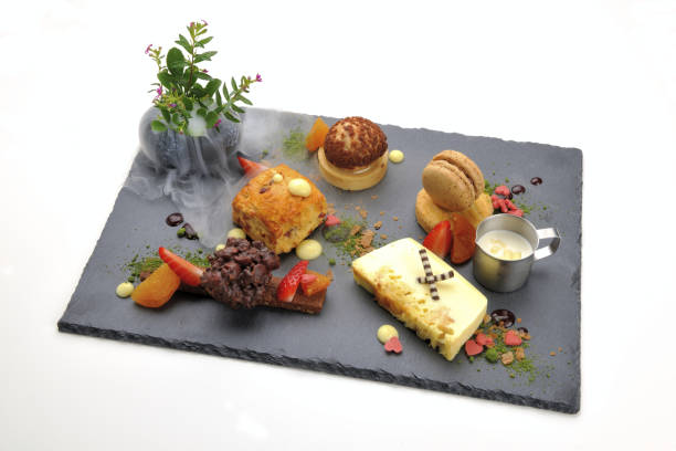 istock Various desserts served on the black plate 1217725524