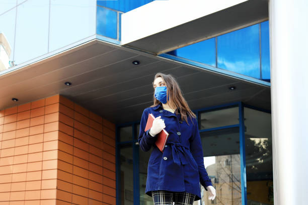 istock Young woman wearing face-protective mask and gloves 1217726637