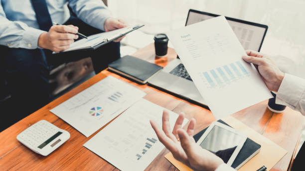 istock teamwork company meeting concept, business partners working with laptop computer together analysing startup financial project result or strategy plan and discussing data document in office 1217727408