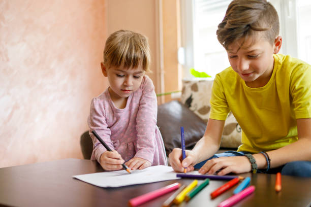 istock Children making drawing at their living room 1217727475