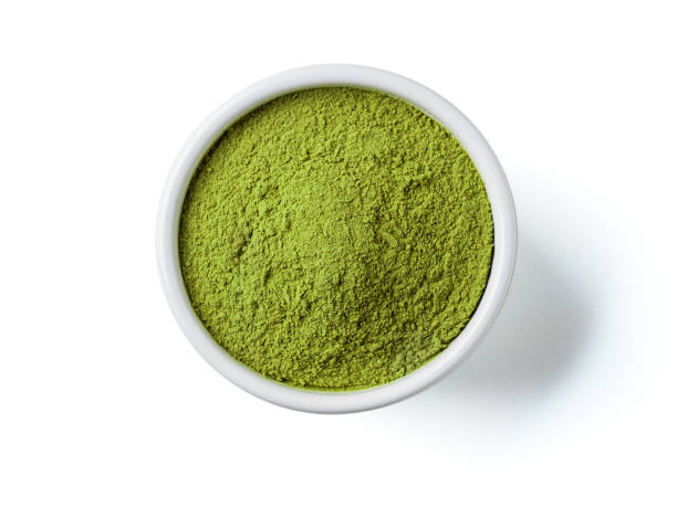 Green matcha tea powder, white background