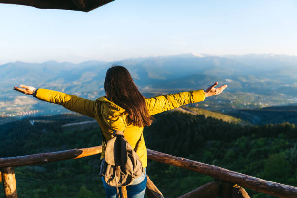 istock Woman standing high up on mountain 1217731392
