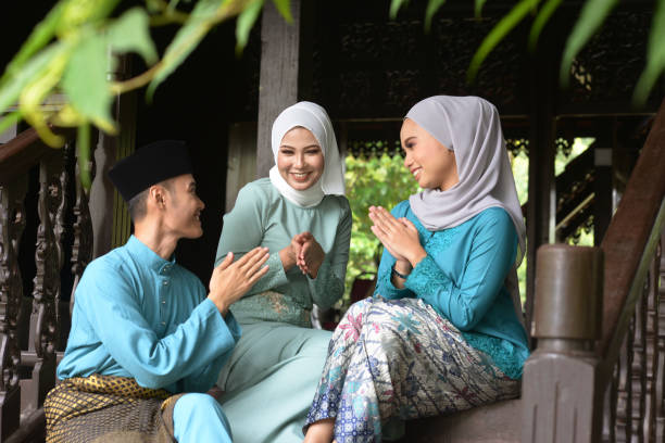 Muslim lifestyle Asian Malay Muslim greetings during Hari Raya Aidilfitri. Malaysian people living lifestyle. malay stock pictures, royalty-free photos & images