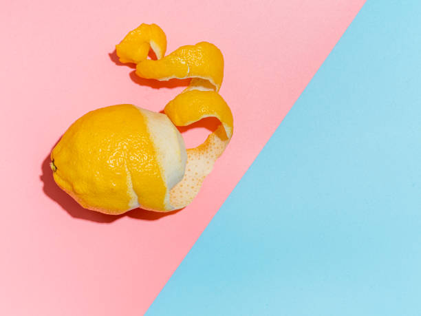 istock lemon with peeled zest, copy space 1217733859