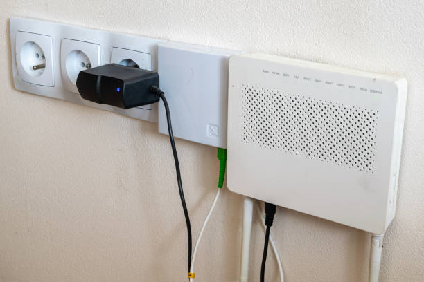 istock electrical outlets and internet modem on a cream wall background 1217738191