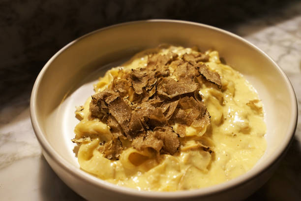 istock Close up sliced Black truffle topped on Carbonara Spaghetti 1217740793