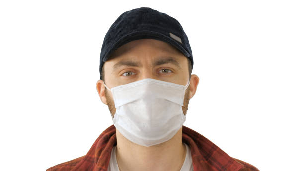 American farmer wearing the protective medical mask looking to c Close up. American farmer wearing the protective medical mask looking to camera on white background. Professional shot cherkasy stock pictures, royalty-free photos & images