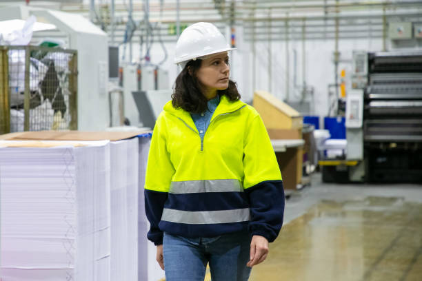istock Serious female industrial professional watching production 1217742535