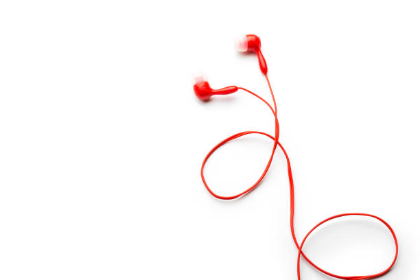 White headphone over pink color background,copy space.