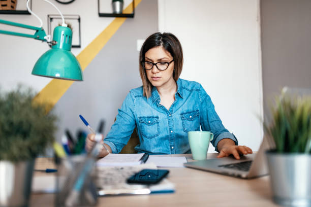 istock Financial advisor working on budget consolidation at home 1217745039