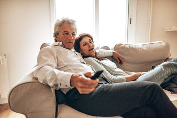 istock couple watching tv during the quarantine 1217745333