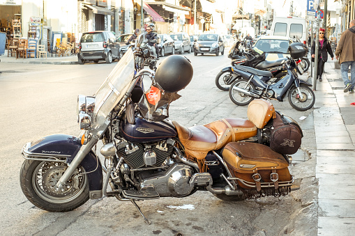 Athens, Greece - February 17, 2020. vintage motorcycle parked on old street of Athens