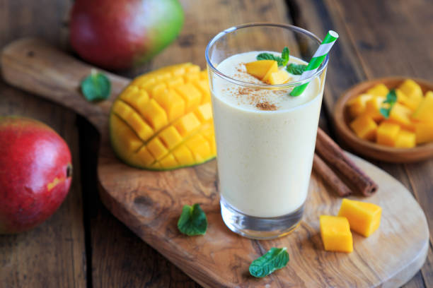 fresh mango lassi and mango fruit stock photo