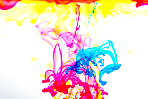 istock drop ink color in the water, colour background, smoke texture 1217752833