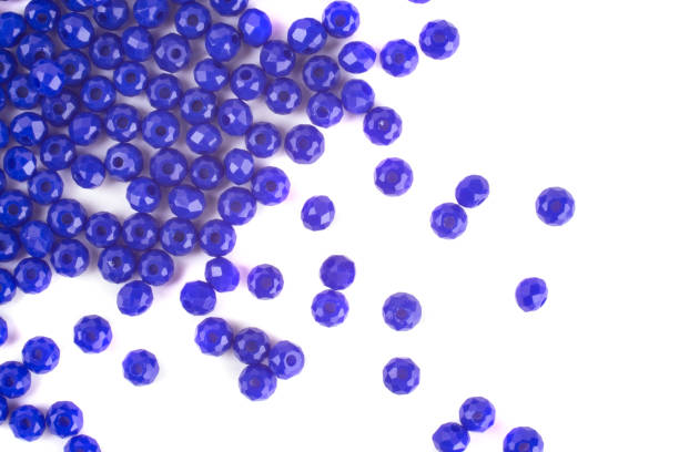 istock close up multi colored beads heap isolated on white 1217755157