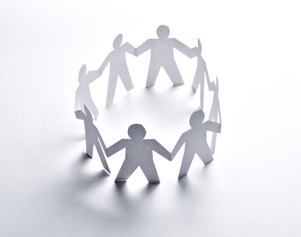 istock paper people community unity togetherness 1217755287