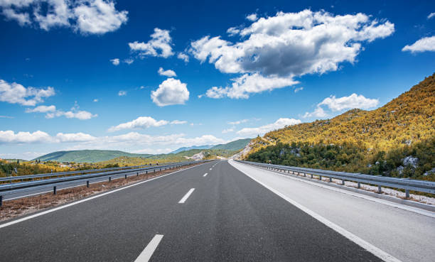 istock Mountain highway with blue sky. 1217755479