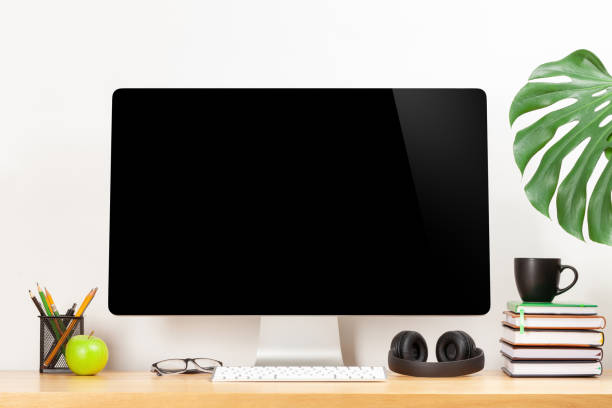istock Stylish home studio workspace with computer, supplies and coffee 1217755496