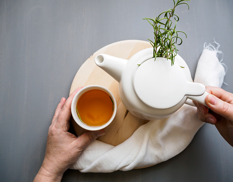 Tea break, drink, hot, isolated, social distance, breakfast, herbal medicine, gray background, modern, fresh rosemary