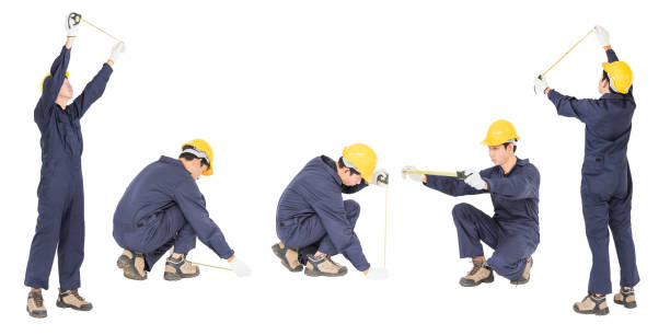 istock Young worker in uniform with tape measure, Cut out isolated on white background 1217758755