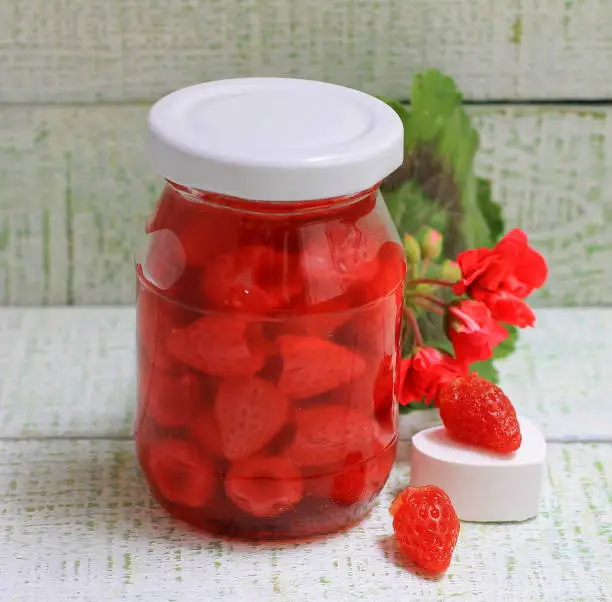 My grandmother's jam stylization with strawberry jam in a glass jar
