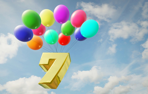 Golden number seven flies high in the sky in balloons. Happy birthday and anniversary. 3d rendered image