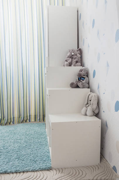 istock White toy storage rack in childrens's room. 1217761805