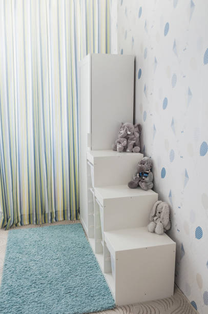 istock White toy storage rack in childrens's room. 1217761839