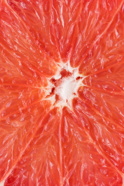 istock Background of delicate pink pulp of sliced grapefruit. 1217762188