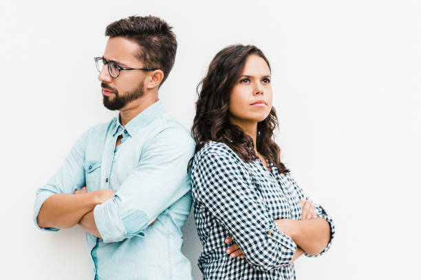 istock Annoyed upset couple standing back-to-back 1217762361