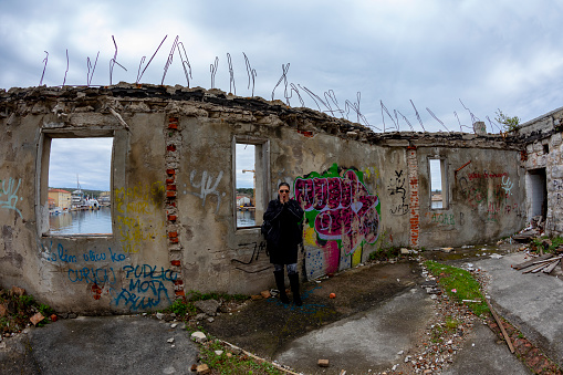 Kraljevica KRK island Croatia April 7, 2019:  An old factory ruins - destroyed by the civil war in former Yugoslavia - standing at