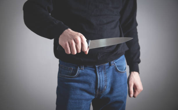 istock Caucasian aggressive man holding knife. 1217763758