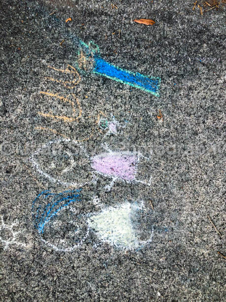 istock Kid's chalk drawing on sidewalk 1217766728