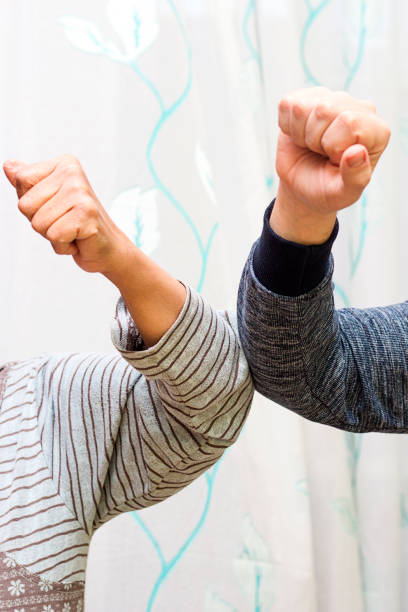 istock Elbow bump - a new and safe way of greeting 1217769962