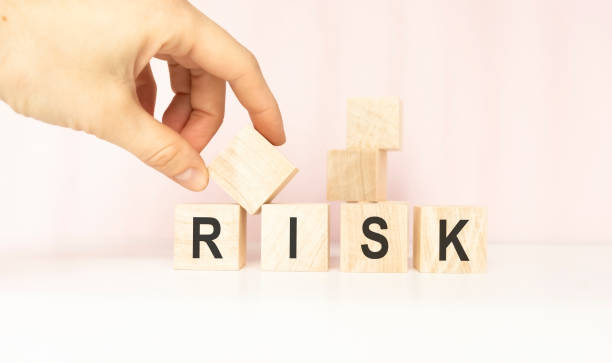 istock Risk Word On Blocks Arranged Behind The Ruler On a light background. 1217770163