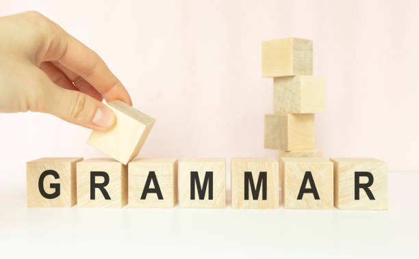 istock grammar word written on wood block. grammar text on table, concept. 1217770166