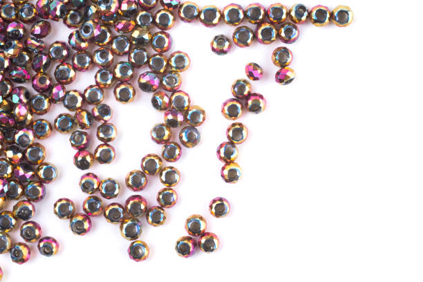 istock close up multi colored beads heap isolated on white 1217771192