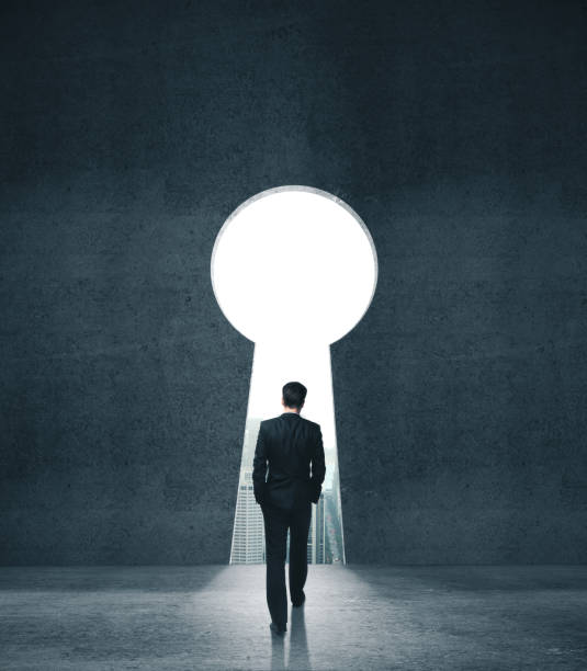 istock Businessman walking to opened concrete wall 1217771278