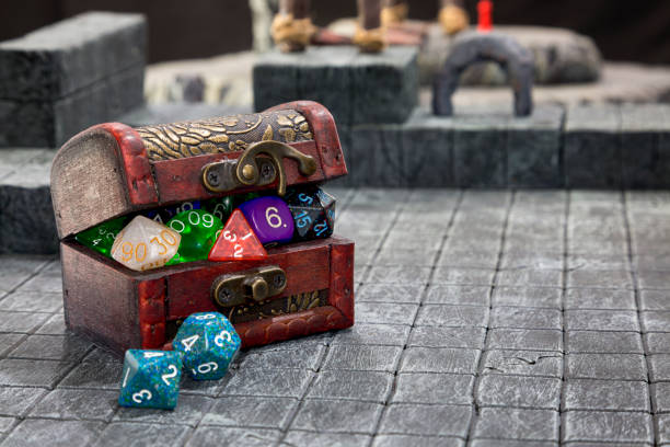 Treasure Chest of Dice A Treasure Chest bulging with Role playing dice. polyhedron stock pictures, royalty-free photos & images