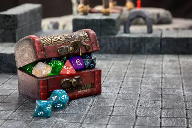 A Treasure Chest bulging with Role playing dice.